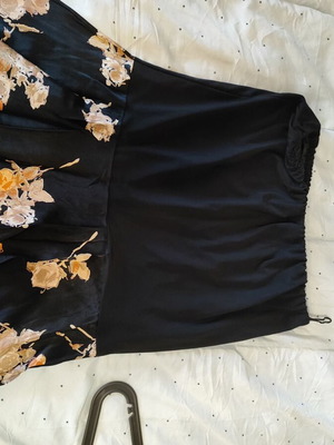 Skirt below the knee used, black with floral pattern, size XL-XXL