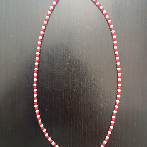 Handmade necklace with white, red beads and turquoise detail