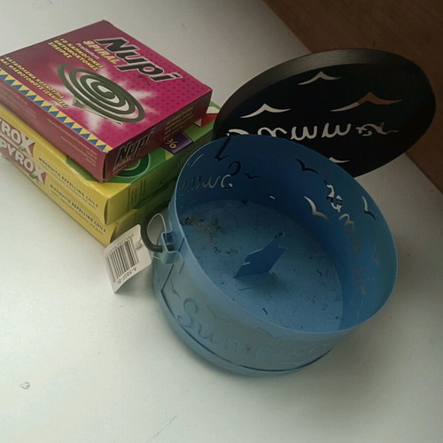Insect repellent container like new, pack with coils