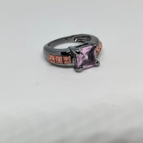 Ring with purple central crystal and pink details in black metal like new