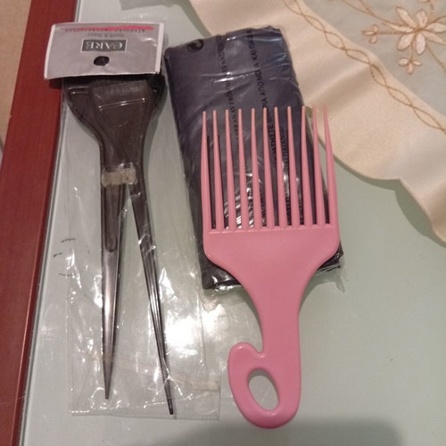 Hair care accessories set with pink afro pick comb and hair dye brushes