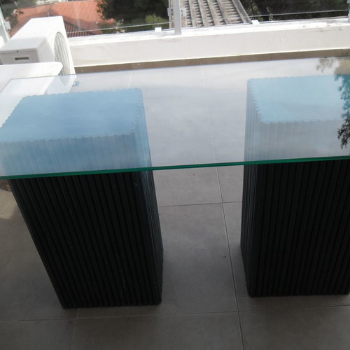 Console table used with 2 blue/navy bases and glass top