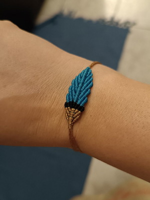 Macrame feather bracelet with adjustable clasp