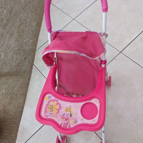 Doll stroller used with wear and fabric tears