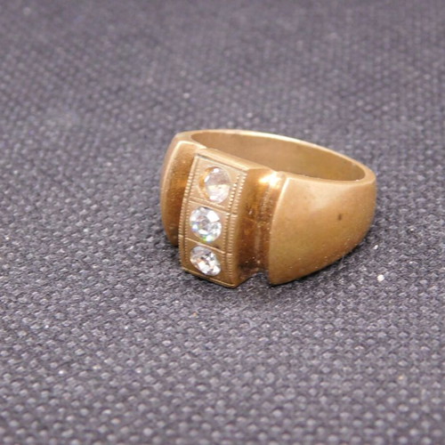 Brass ring with 3 zircon stones