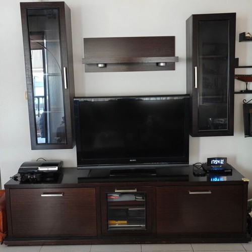 Living room unit used with lower cabinet, wall columns, and shelves