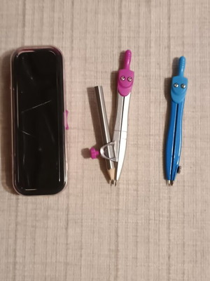 Set of two compasses with pink storage case like new
