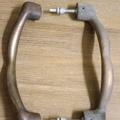 Pair of vintage brass door handles 1950 with natural patina used