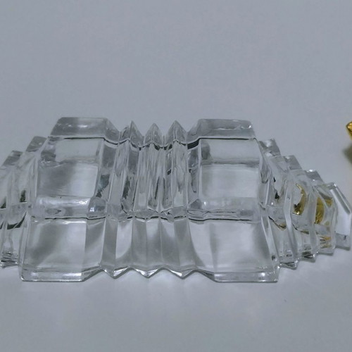 Set of gilded miniature salt and pepper shakers with lead tray