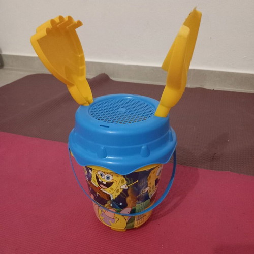 SpongeBob Beach Bucket used with shovel and rake