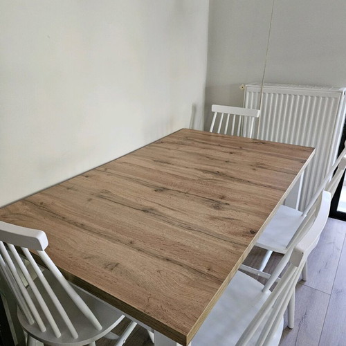Extendable table used with folding mechanism and deco veneer surface