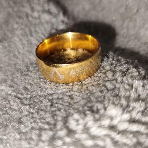 Assassin's Creed ring like new, gold color