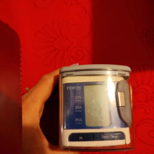 Wrist blood pressure monitor used with broken plastic case