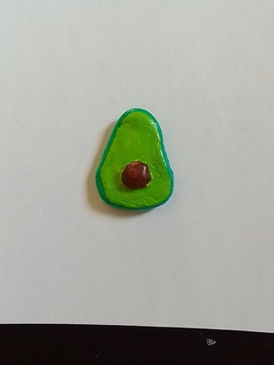 Handmade avocado magnet from clay