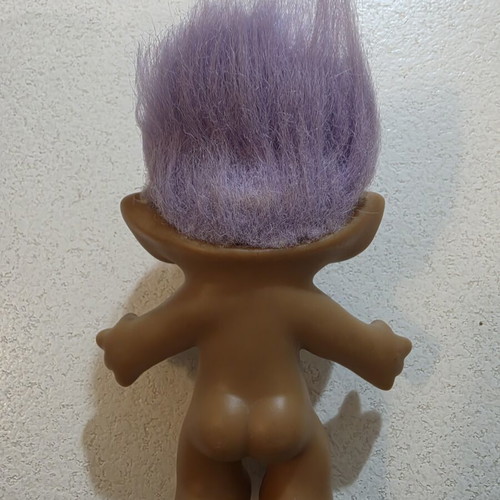 Efxoulis collectible with diamond, 1980s, used, trimmed hair
