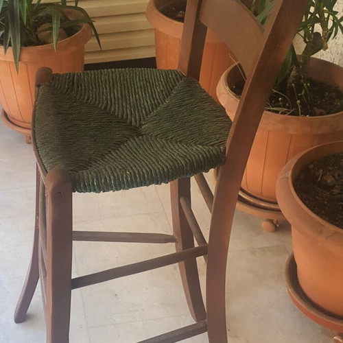 Wooden high chair with woven seat