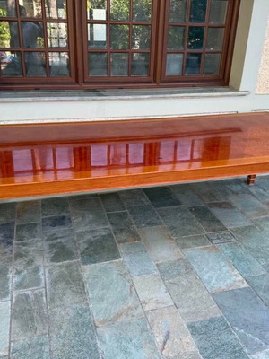 Solid wood dining table with decorative border and square legs
