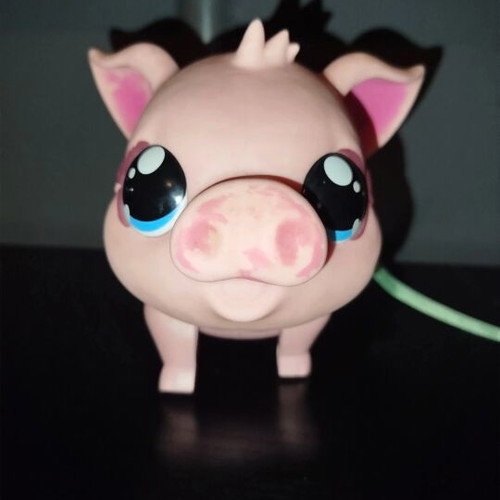 Electronic robotic pig used with sound and movement