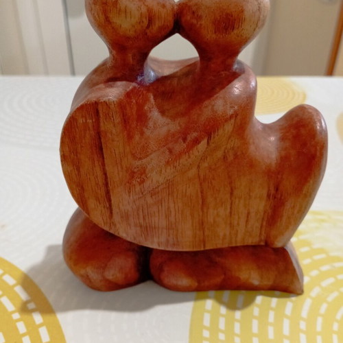 Decorative wooden sculpture of a couple, suar wood