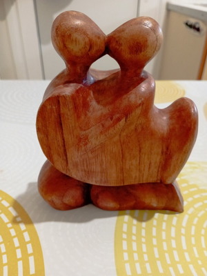 Decorative wooden sculpture of a couple, suar wood