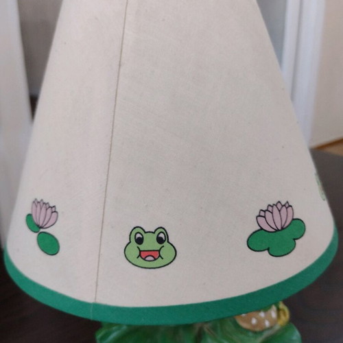 Table lamp used with decorative frog figurines
