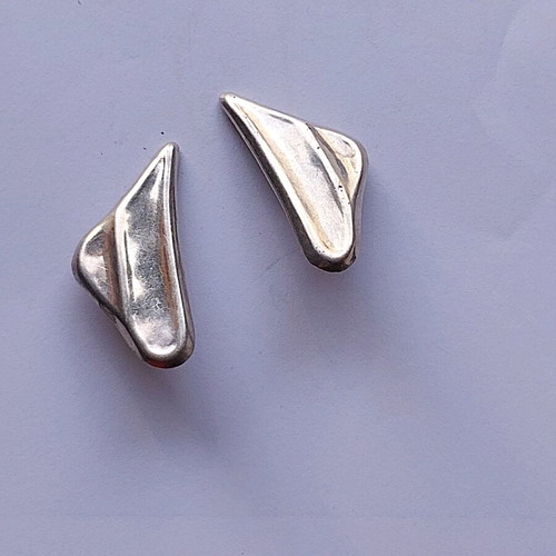 Silver earrings used with clip