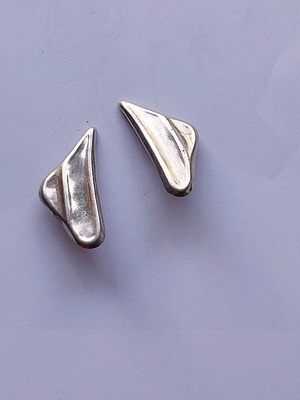 Silver earrings used with clip