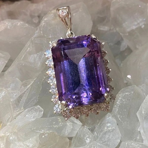 Silver pendant with large cut natural amethyst stone and moissanites