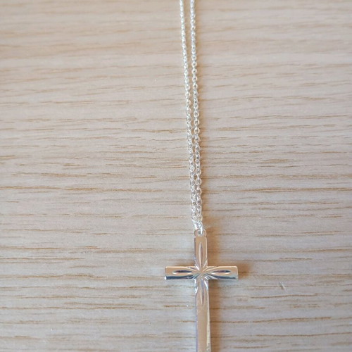 Steel cross like new, silver color