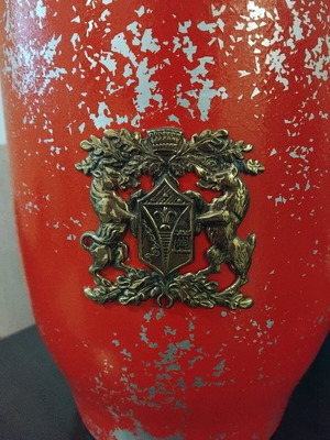 Metal emblem with plastic container used