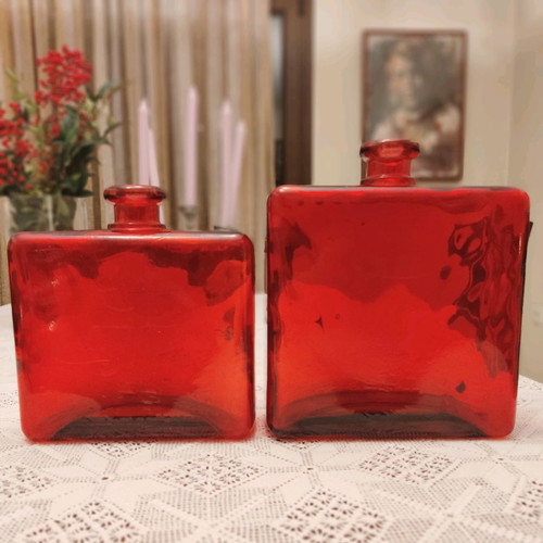 Set of two used decorative red glass vases made in Spain