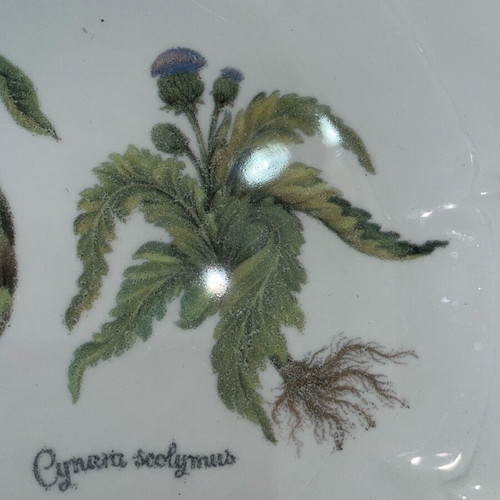 Ceramic serving dish used with artichoke design