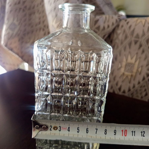 Square glass bottle vintage with embossed design without stopper
