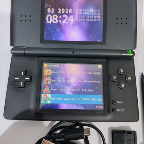 Nintendo DS Lite console used with Pokemon LeafGreen cartridge and accessories