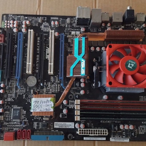 Asus M4A79T Deluxe motherboard used with CPU, fan and 16GB RAM