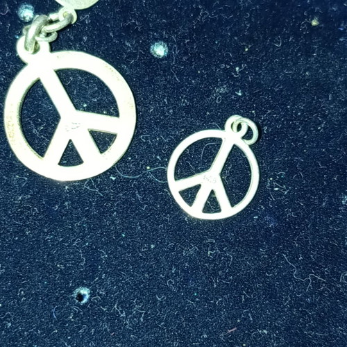 Peace symbol silver pendants set like new, two pieces