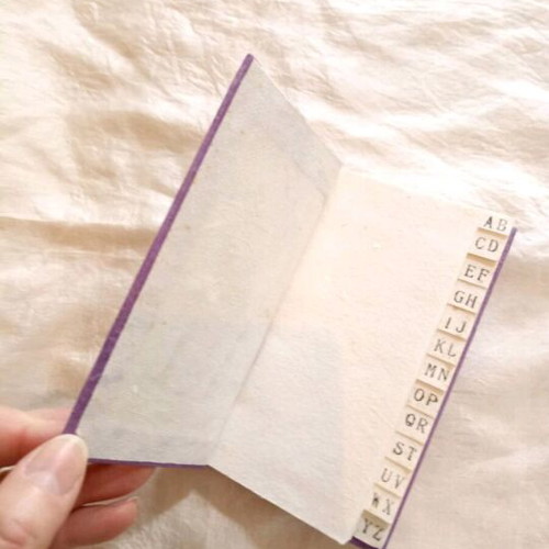 Decorative notepad with index used, purple, natural paper