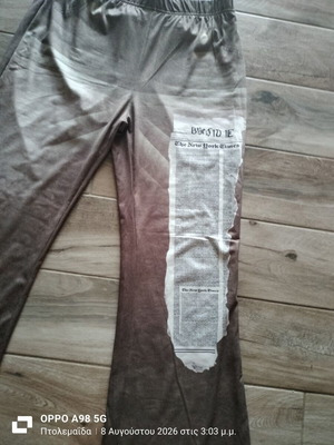 Elastic bell-bottom pants with front print, like new, size XL
