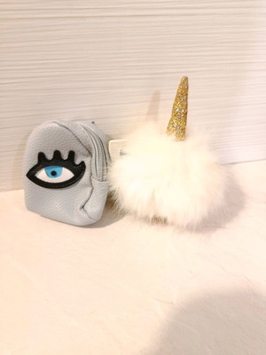 Pom Pom keychain with unicorn ears, like new, white