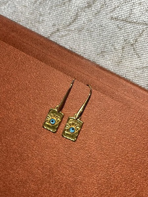 Steel earrings with eye charm like new, gold tone