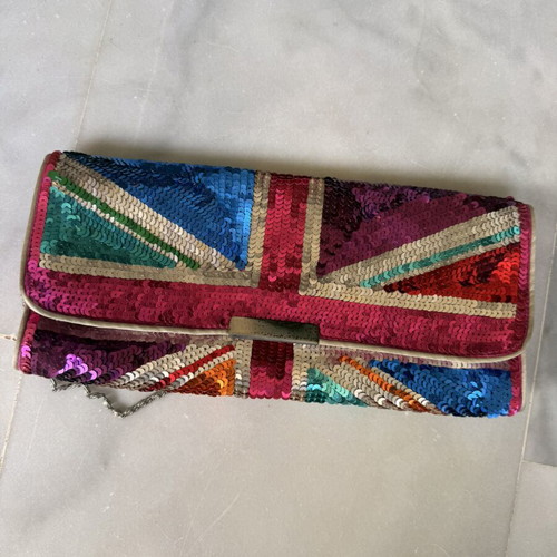 Accessorize clutch like new with colorful sequins and chain