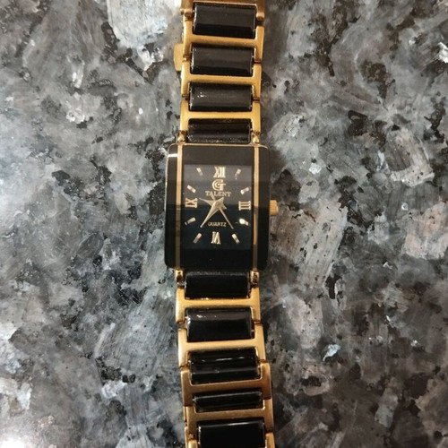 Women's wristwatch used, black and gold, 22cm bracelet