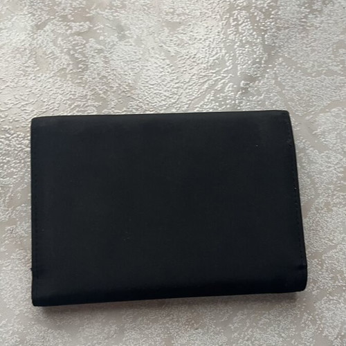 Women's black wallet like new with textured surface
