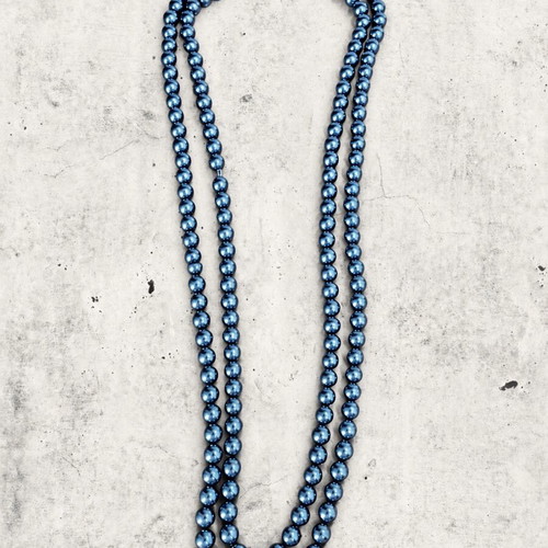 Necklace used with blue shiny beads in minimal vintage style