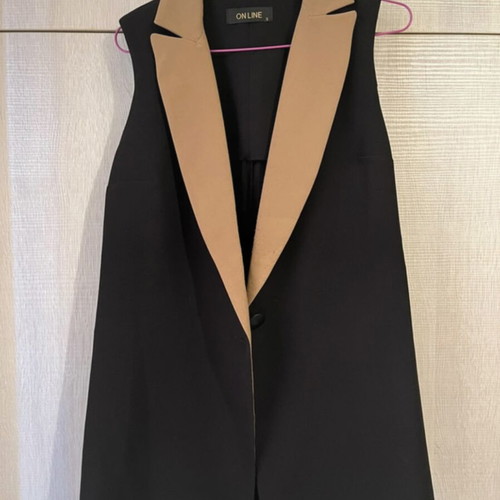 Sleeveless jacket used, black and tan, size small