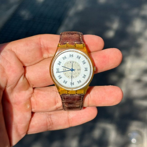 Vintage Swatch Swiss watch 34mm, transparent yellow case, brown strap