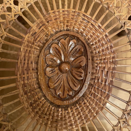 Oval living room coffee table with rattan and carved medallion