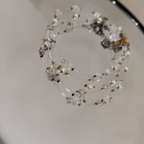 Handmade bracelet with crystals, pearls, and steel elements