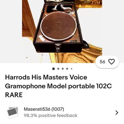His Master's Voice portable gramophone used with accessories