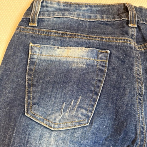 Vintage blue Rococo jeans with studs and rips like new